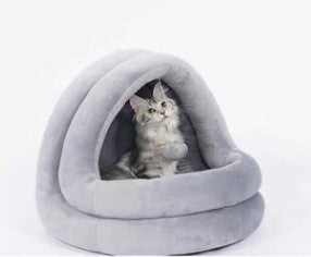 Enclosed hooded cat bed providing security and comfort